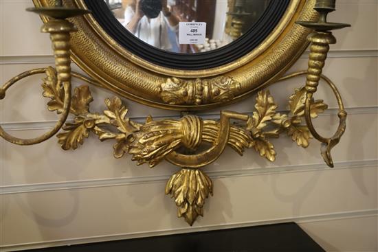 A Regency giltwood and gesso convex wall mirror, W.1ft 11in. H.2ft 7in.
